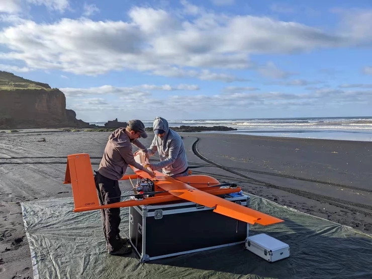 MAUI 163 team is working on CW-25 before flight. 